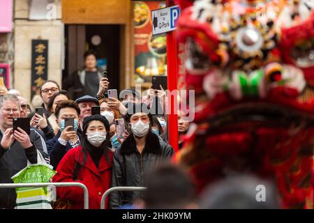 London, UK.  1 February 2022. Lion dancers entertain crowds during a visit by The Prince of Wales and The Duchess of Cornwall to celebrate the Lunar New Year, the Year of the Tiger with a visit local shops, organisations and communities.  Credit: Stephen Chung / Alamy Live News Stock Photo