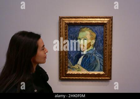 this is the first time the full span of Van Gogh's self-portraiture has been explored in an exhibition and it is the largest group to be brought together in more than 25 years .Alongside 16 self portraits , the exhibition features two major paintings that played an important role in Van Gogh's fashioning of his own image . Van Gogh's chair , described by the artist as symbolic ( self portrait ). and Portrait of Eugene Boch , a portrait of his friend in which van Gogh sought to convey his artistic ideals  . Opens to the public  from  3  February 2022 - 8 May 2022 . Stock Photo