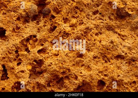 Yellow sand stone rock detailed textured wall Stock Photo