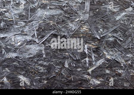 Old aged weathered OSB chipboard texture. Grunge ruined wooden background copy space Stock Photo