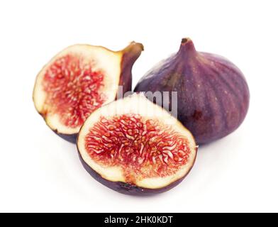 Fresh figs. Fruit with half and quarter isolated on white background. With clipping path. Stock Photo