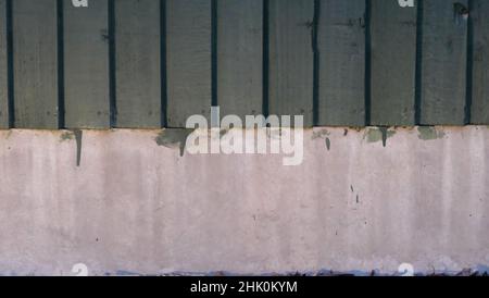 View of painted wooden fence above concrete with copy space Stock Photo