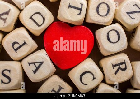 Red Love icon and Letter cubes of made of wood Stock Photo - Alamy