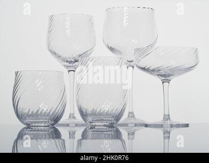 A set of glassware. Drinking vessels or drinkware. Domestic glasses for drinking liquids from. Stock Photo