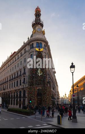 The luxurious Four Seasons hotel with the Hermes shop decorated with a giant Christmas tree against the facade for the wonderful and joyful holidays Stock Photo