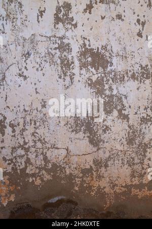 Old lime washed wall with damp, distressed grunge background Stock Photo