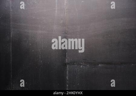 Black plaster finish on concrete wall, grunge background or texture Stock Photo