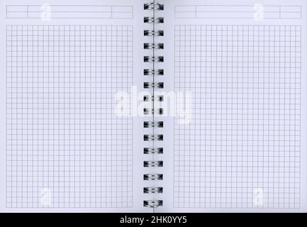 An open spiral block with white checkered paper Stock Photo