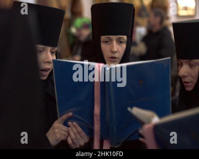 Number of nuns singing in a church in Ukraine on a blurred background Stock Photo