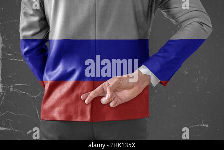 Businessman Jacket with Flag of America with his fingers crossed behind his back Stock Photo