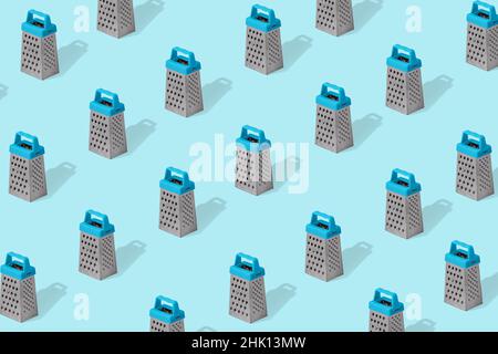 Creative colorful pattern of grater on bright blue background. Kitchen symbol. Cooking utensil. Cutlery sign. Trendy Minimal concept. Stock Photo