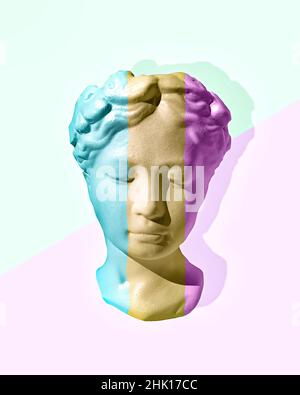 Creative futuristic head sculpture of woman with neon lights on pastel background with copy space in a pop art style. Cyberpunk, webpunk and surreal s Stock Photo