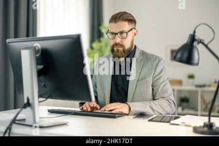 Man working on pc Stock Photo