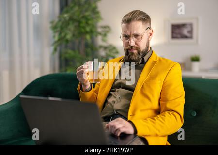 Man using laptop at home Stock Photo