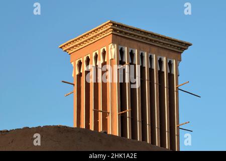 Badgir, a wind tower on the roof in the ancient city of Yazd in Iran, badgir is a traditional Persian architectural feature that creates natural venti Stock Photo