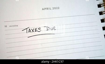 Calendar reminder that US taxes are due on April 18, 2022. Usually due on April 15, the deadline was extended this year because of Good Friday. Stock Photo