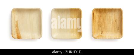 Set of three palm leaf plates isolated on a white background. Empty square textured plate of dry Areca palm leaves. Eco-friendly disposable  tableware Stock Photo