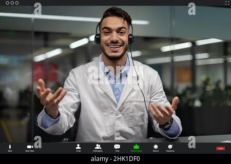 Pov screen of handsome middle eastern scientist having video chat Stock Photo
