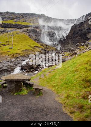 Waterfall Fossa (Fossá) during strong wind in rainy weather, Streymoy Island, Faroe Islands, Denmark - Gasadalur Mulafossur Waterfall Stock Photo