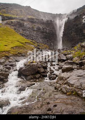 Waterfall Fossa (Fossá) during strong wind in rainy weather, Streymoy Island, Faroe Islands, Denmark - Gasadalur Mulafossur Waterfall Stock Photo