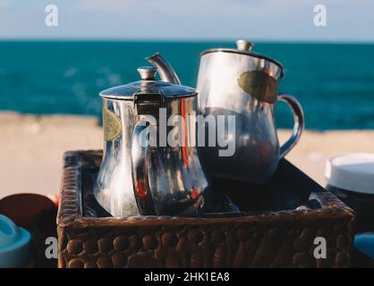 Outdoor cafe pots close up for making arabic turkish coffee at mediterranean seaside for enjoing in Alexandria, Egypt Stock Photo