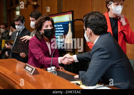 United States Secretary of Commerce Gina Raimondo greets US Senator Brian Schatz (Democrat of Hawaii) ahead of a Senate Appropriations Subcommittee on Commerce, Justice, Science, and Related Agencies hearing on expanding broadband access on Capitol Hill in Washington, on Tuesday Feb. 1, 2022.Credit: Sarah Silbiger/Pool via CNP /MediaPunch Stock Photo