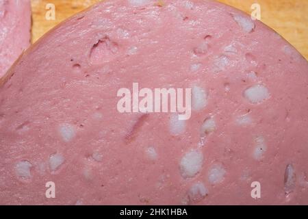 Boiled sausage slice close up background Stock Photo