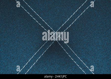 Dark blue denim background with white stitching close up background Stock Photo