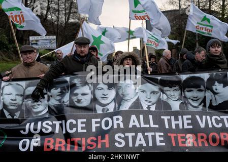 A group of demonstrators march with flags waving and a banner reading 'Justice for the victims of British state terrorism!' during the remembrance walk to honour the victims.On January 30, 1972, the British Army's Parachute Regiment shot and killed 14 civilians. Victims' families, locals, supporters, and politicians commemorate the 50th anniversary of Bloody Sunday in Derry. The Prime Minister of Ireland, Micheál Martin, Member of Parliament Mary Lou McDonald, and Simon Coveney, Minister for Foreign Affairs of Ireland, all attended this year's event. (Photo by Natalia Campos/SOPA Images/Sip Stock Photo