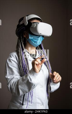 Medical worker is using virtual reality helmet Stock Photo