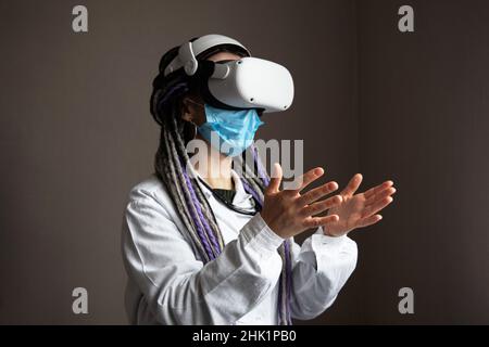 Medical worker is using virtual reality helmet Stock Photo