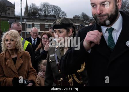 Derry, UK. 30th Jan, 2022. A group of people leaving the remembrance walk to honour the victims.On January 30, 1972, the British Army's Parachute Regiment shot and killed 14 civilians. Victims' families, locals, supporters, and politicians commemorate the 50th anniversary of Bloody Sunday in Derry. The Prime Minister of Ireland, MicheÃl Martin, Member of Parliament Mary Lou McDonald, and Simon Coveney, Minister for Foreign Affairs of Ireland, all attended this year's event. (Credit Image: © Natalia Campos/SOPA Images via ZUMA Press Wire) Stock Photo