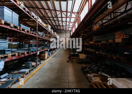 Steel construction materials and parts in the warehouse. Stock Photo