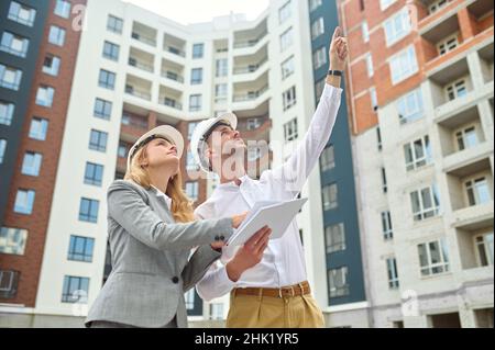 Two people examining a new construction object Stock Photo