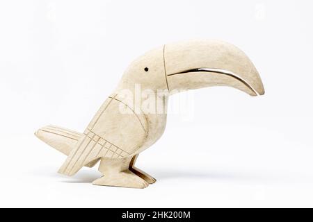 Wooden statue of toucan bird handcrafted on white background isolated Stock Photo
