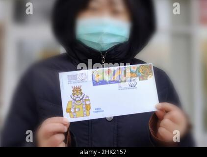 Bucharest. 21st Jan, 2023. Photo taken in Bucharest, Romania on Feb. 1, 2022 shows a 'first day' cover issued by Romfilatelia in celebration of the Chinese New Year of the Tiger. Romfilatelia, the institution designed to issue Romanian postage stamps, launched on Tuesday commemorative stamps to celebrate the Chinese New Year of the Tiger. The Year of the Tiger is the third zodiac sign in the Chinese zodiac cycle. It starts on Feb. 1, 2022 and lasts until Jan. 21, 2023, according to the Chinese lunar calendar. Credit: Chen Jin/Xinhua/Alamy Live News Stock Photo