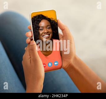 Unrecognizable lady holding smartphone and making video call with her bestie, closeup, creative collage Stock Photo