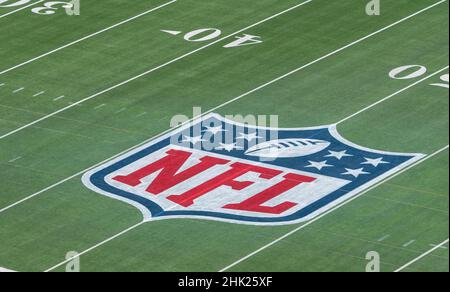 01 February 2022, US, Inglewood: Workers paint the Super Bowl LVI logo on  the field at SoFi Stadium. The Los Angeles Rams and Cincinnati Bengals will  meet here on Feb. 13, 2022 (