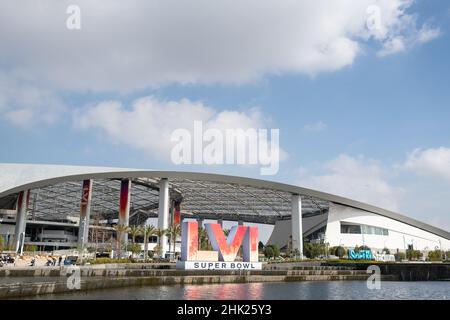 01 February 2022, US, Inglewood: Workers paint the Super Bowl LVI logo on  the field at SoFi Stadium. The Los Angeles Rams and Cincinnati Bengals will  meet here on Feb. 13, 2022 (