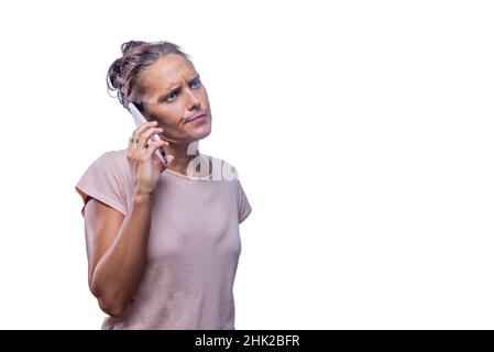annoying adult woman talking with her phone while looking away Stock Photo