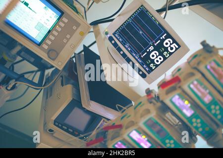 Complicated medical equipment for life support monitoring in the critical care unit. Stock Photo