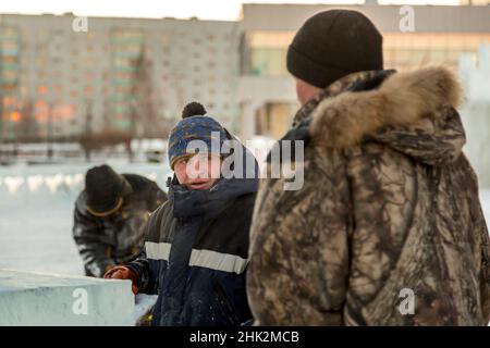 Installers at the construction site are talking Stock Photo