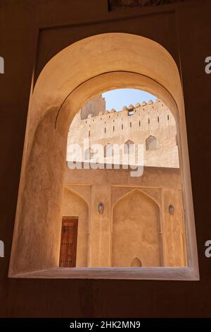 Middle East, Arabian Peninsula, Oman, Ad Dakhiliyah, Bahla. View through a window in Jabreen Castle. (Editorial Use Only) Stock Photo