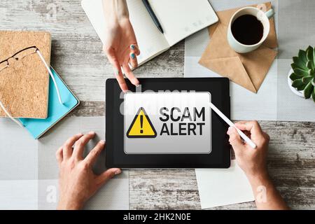 Scam alert detecting warning. Notification on device screen. Stock Photo