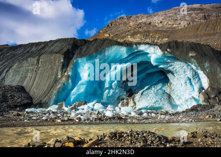 Blue ice and meltwater at the toe of the Athabasca Glacier, Jasper National Park, Alberta, Canada Stock Photo