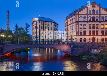 Sweden, Norrkoping, early Swedish industrial town, Arbetets Museum, Museum of Work in former early 20th century mill building, dusk Stock Photo