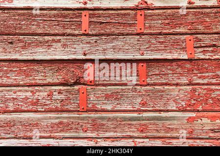 Latah, Washington State, USA. Peeling red paint on a weathered old barn. Stock Photo