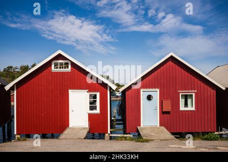 Sweden, Bohuslan, Hamburgsund, red fishing shacks Stock Photo