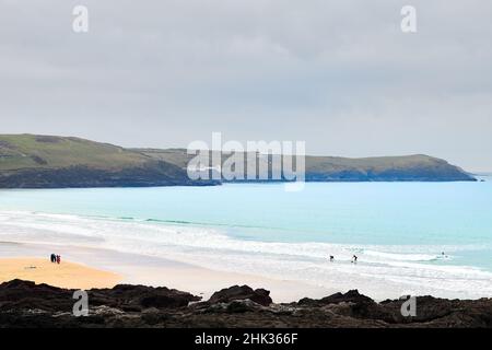 Onlookers at Fistral beach, Newquay, England, on a winter day with little surf. Stock Photo