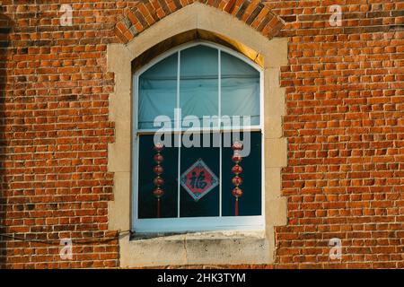 Windsor, UK. 1st February, 2022. Lunar New Year decorations are pictured in the window of a Jacobean-style Victorian terraced house. People across the world are welcoming the Year of the Tiger on 1st February 2022. Credit: Mark Kerrison/Alamy Live News Stock Photo